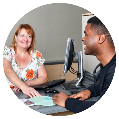 financial aid staff helping male student